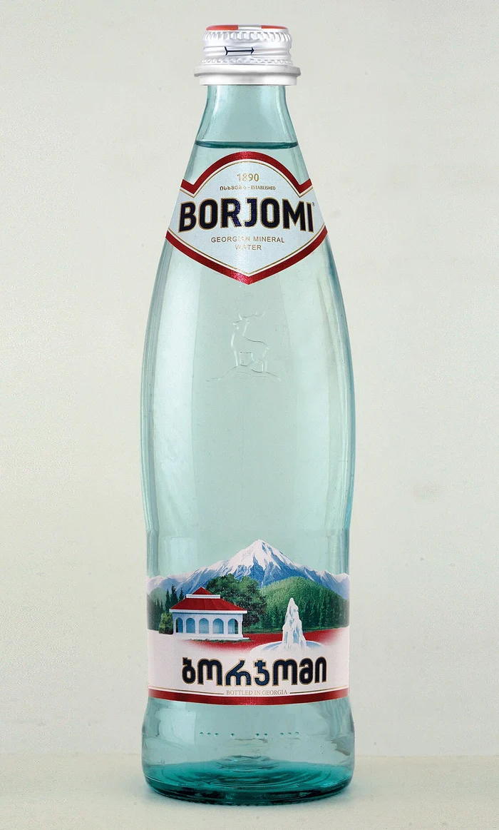 Borjomi, 2010: The half-litre glass bottle in the design introduced in 2010, with the deer embossed in the glass and "1890 Established" on the neck label.